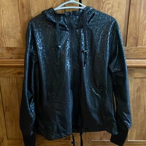 Zyia active running jacket, black on black animal print